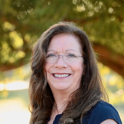 Linda Hill Smiling Outdoors