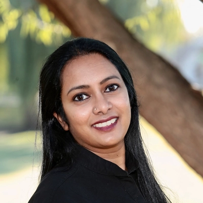 Pediatric Dentist Archana Gutta Outdoors Smiling
