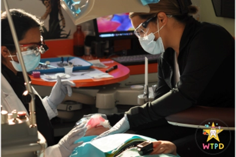 Archana Gutta With A Patient And Hygienist In An Exam