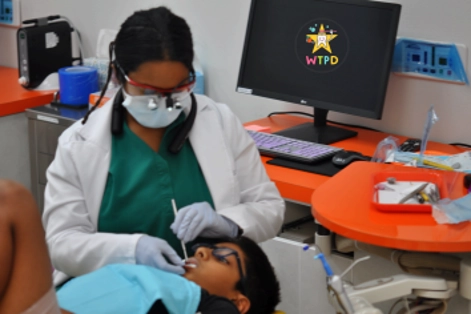 Archana Gutta With A Patient In An Exam