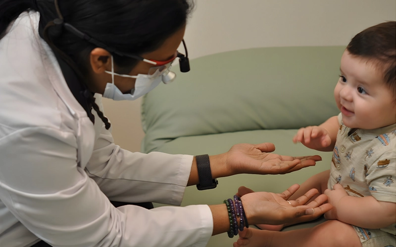 Archana Gutta With A Pediatric Patient Alt